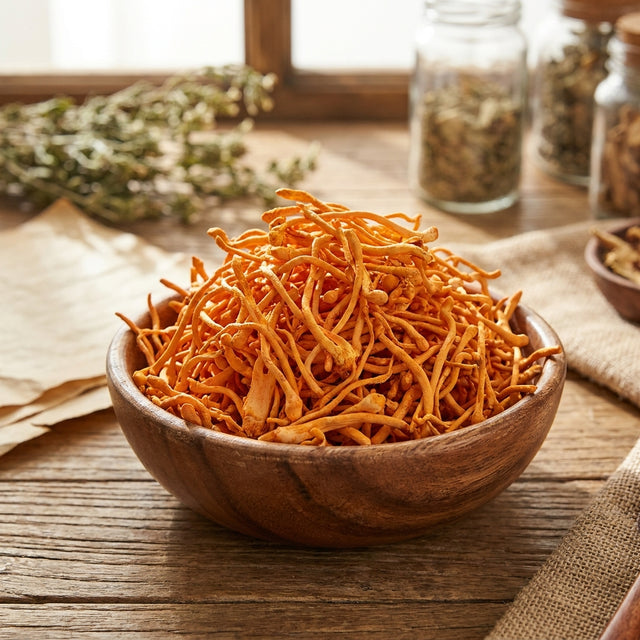 A wooden bowl of dried cordyceps mushrooms